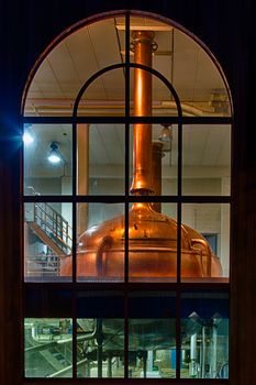 Traditional copper distillery tanks in a beer brewery