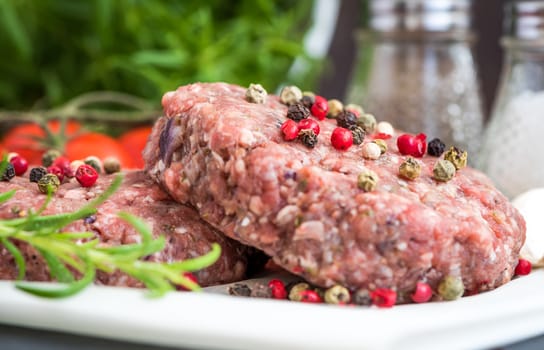 Raw Minced Hamburger Meat with Herb and Spice Prepared for Grilling