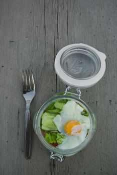 Caesar salad with eggs, cherry tomatoes and grilled chicken