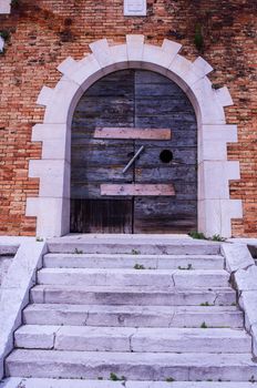 View of old wooden door in Venice