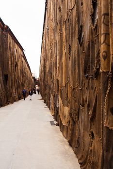 VENICE, ITALY - MAY 06: View of "Out of Bounds" Ibrahim Mahama site specific installation composed with jute bags and mixed media showing at Arsenale during the 56th Venice Biennale on May 06, 2015