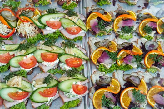 Selection of Smoerrebroed Danish open faced sandwiches on display                            