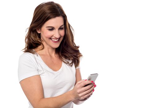 Image of a woman operating her smart phone