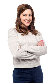 Attractive woman posing with folded arms over white