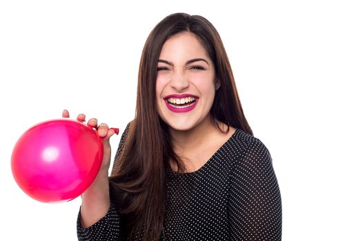 Happy woman with red balloon for birthday party