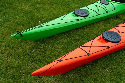 Colorful kayaks on the beach ready for extreme sport activity                               