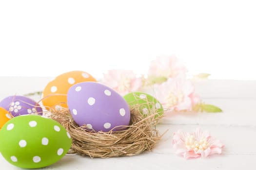 colorful easter eggs and branch with flowers
