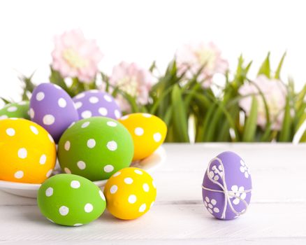 Easter eggs and Fresh Green Grass on White Background