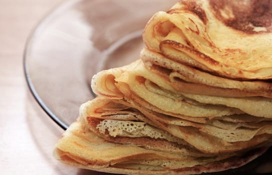 Close up of a pancakes pile with copy-space on the top
