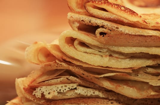 Close up of a pancakes pile with copy-space on the top