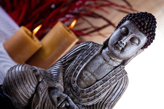 Buddha with candle, vivid colors, natural tone