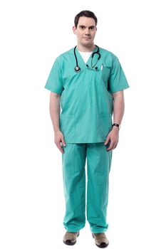 Full length of male doctor posing over white