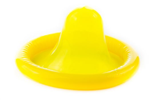 yellow condom on white background
