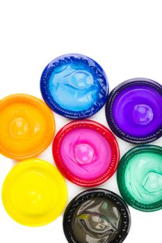 colorful condom on white background from top view