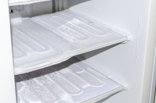 View of an empty freezer. The freezer is defrosted