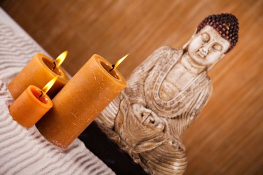 Buddha with candle, vivid colors, natural tone