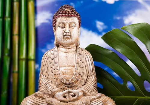 Buddha and blue sky background, vivid colors, natural tone