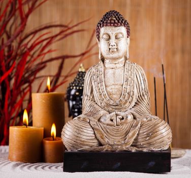 Buddha with candle, vivid colors, natural tone