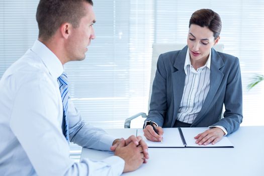 Business people in discussion in an office at work