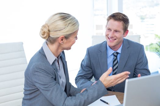 Business people using laptop in the office