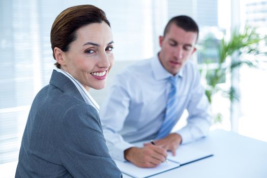 Business people in discussion in an office at work