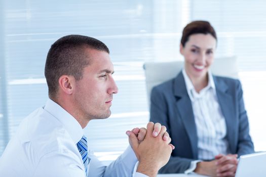 Business people in discussion in an office at work