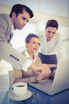 Business partners working on laptop in the office