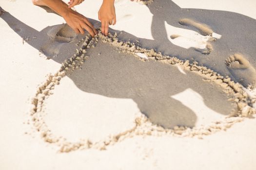 one heart drawn in the sand at the beach