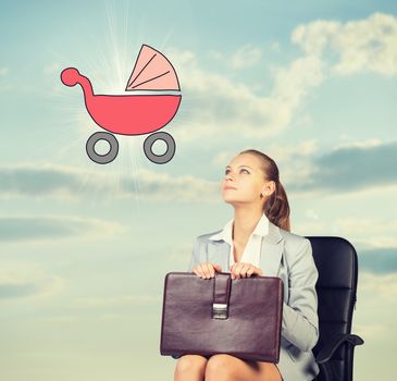 Business woman in skirt, blouse and jacket, sitting on chair imagines buggy. Against background of sky and clouds