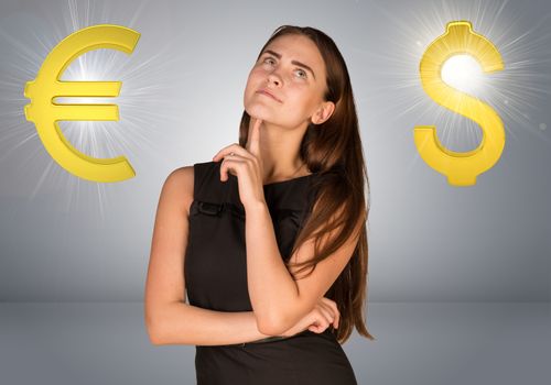 Business woman thinking over dollar sign and euro sign. Gray gradient background