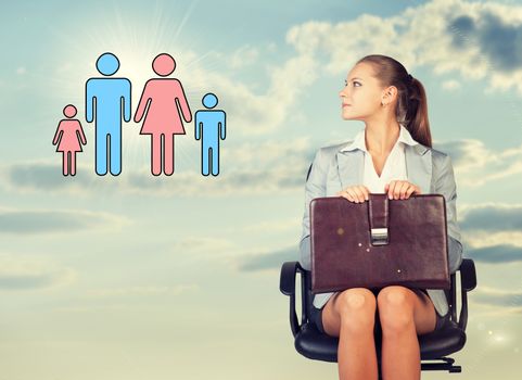 Business woman in skirt, blouse and jacket, sitting on chair and holding briefcase imagines family. Against background of sky and clouds