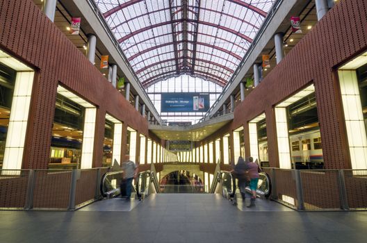 Antwerp, Belgium - May 11, 2015: People in Antwerp Central Railway Station on May 11, 2015 in Antwerp, Belgium. The station is now widely regarded as the finest example of railway architecture in Belgium.