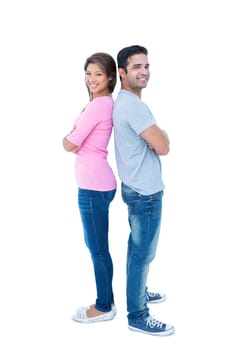 Happy couple standing back to back on white background