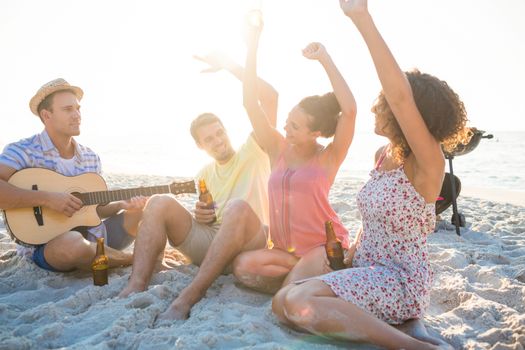 group of friends having fun at the beach