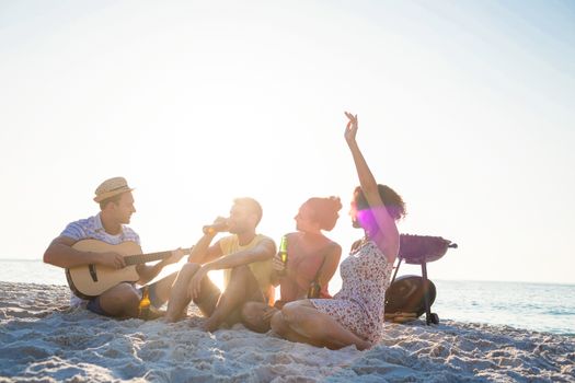 Group of friends having fun at the beach