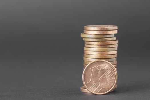 One cents of euro isolated on a dark background to understand a business concept