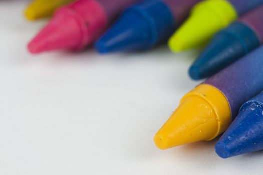 Close up of different coloured crayons