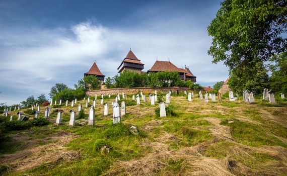 Viscri, Romania - June 23, 2013: Fortified Church cemetery at Viscri in Transylvania, Romania