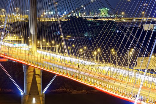 highway bridge at night with traces of light traffic, Ting Kau bridge at hong kong.