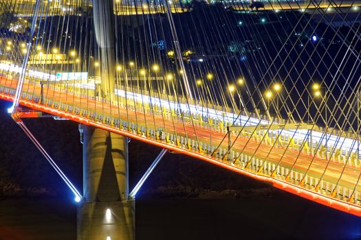 highway bridge at night with traces of light traffic, Ting Kau bridge at hong kong.