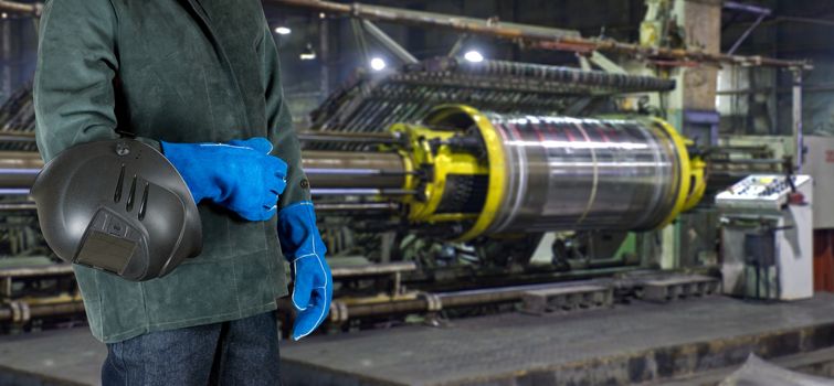 Worker with instruments at industrial factory