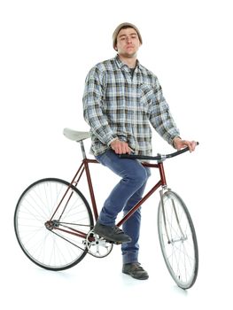 Young man doing tricks on fixed gear bicycle on a white background