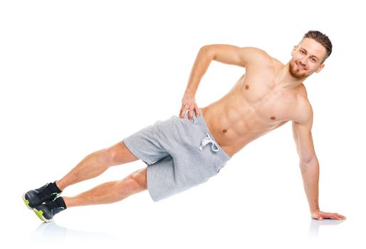 Sport attractive man doing fitness exercises on the white background