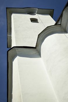 architectual background White church tower from bottom