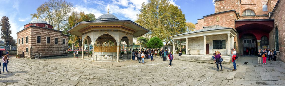 ISTANBUL - SEPTEMBER 21, 2014: Tourists enjoy city life in Sultanahmet Park. Istanbul attracts more than 10 million every year.