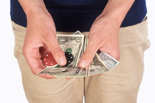 Man Holding Dollar Bills and Casino Chips.