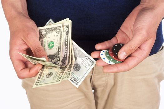 Man Holding Dollar Bills and Casino Chips.