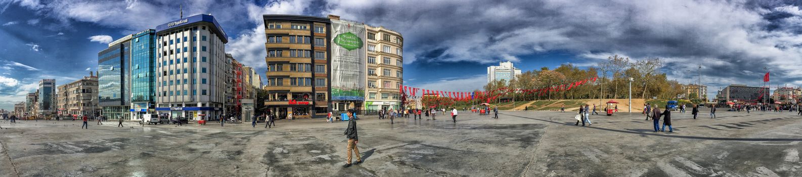 ISTANBUL, TURKEY - OCTOBER 23, 2014: People walking at Taksim Square in Istanbul. Taksim Square is a leisure district famous for its restaurants, shops, and hotels.