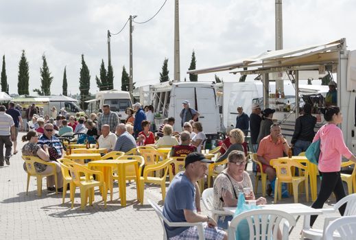 LOULE,PORTUGAL - APRIL 22: people enjoy their drinks and food on the teracce  at the market on April 22, 2015 in Loule, Portugal,this is an anual market aranged by roman families