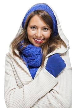 Close up Pretty Smiling Young Woman Wearing Winter Knit Outfit with Blue Bonnet, Scarf and Gloves. Captured in Studio with White Background While Looking at the Camera.